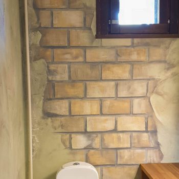 Vessan seinän maalaus tiilikuviolla